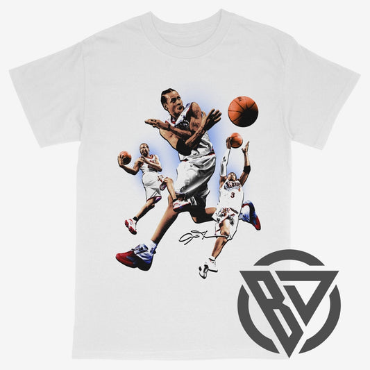 A white short-sleeve crewneck t-shirt featuring a graphic print of basketball player Allen Iverson in mid-air, wearing a white jersey and red-and-white sneakers, with an orange basketball. A dark gray circular logo with stylized letters 'BD' is printed on the bottom right.